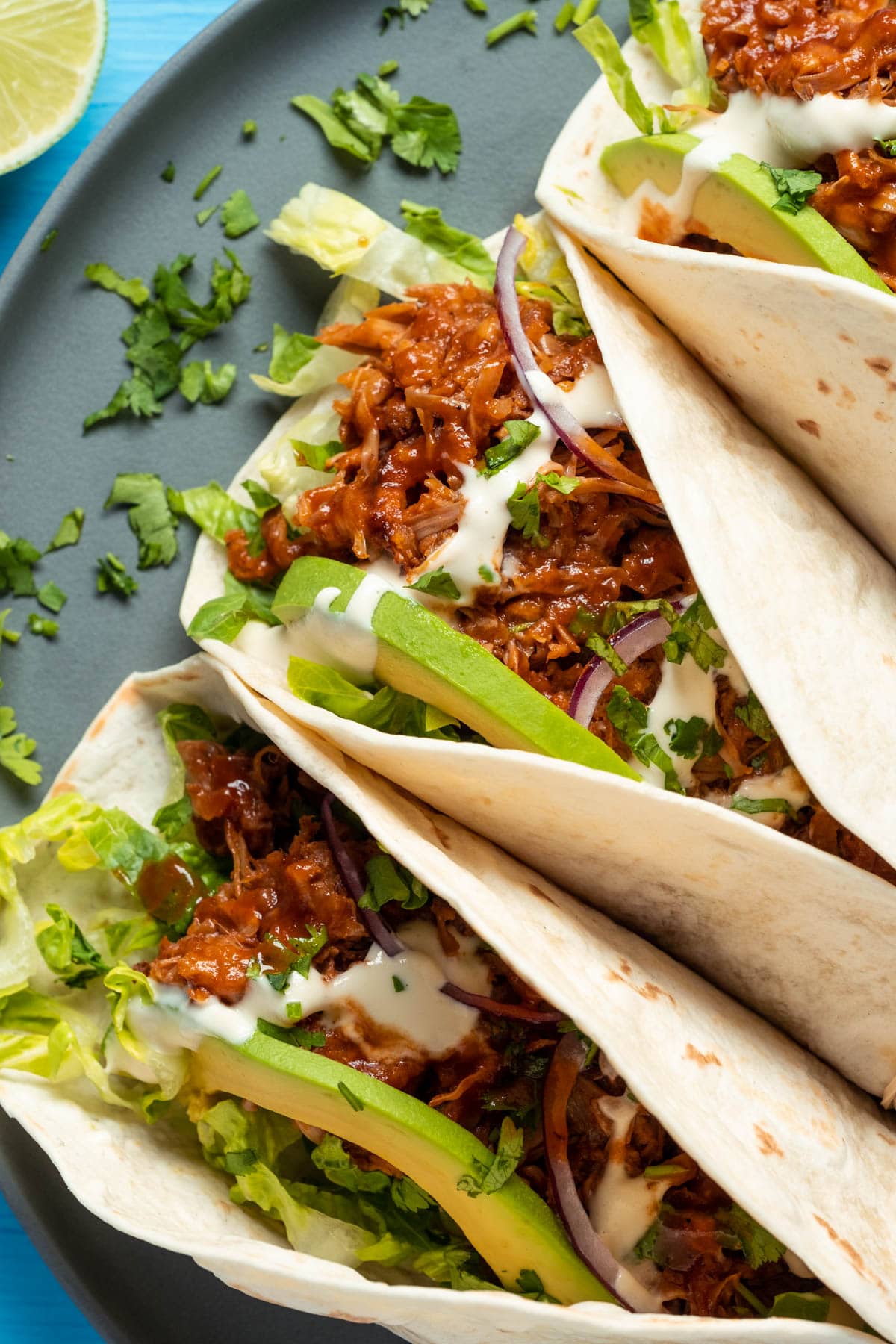 Jackfruit tacos on a gray plate.