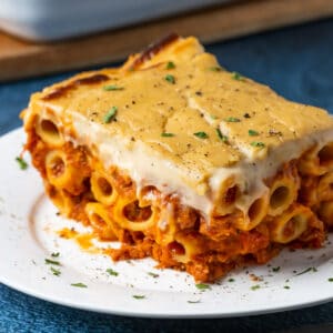 Slice of vegan baked ziti on a white plate.