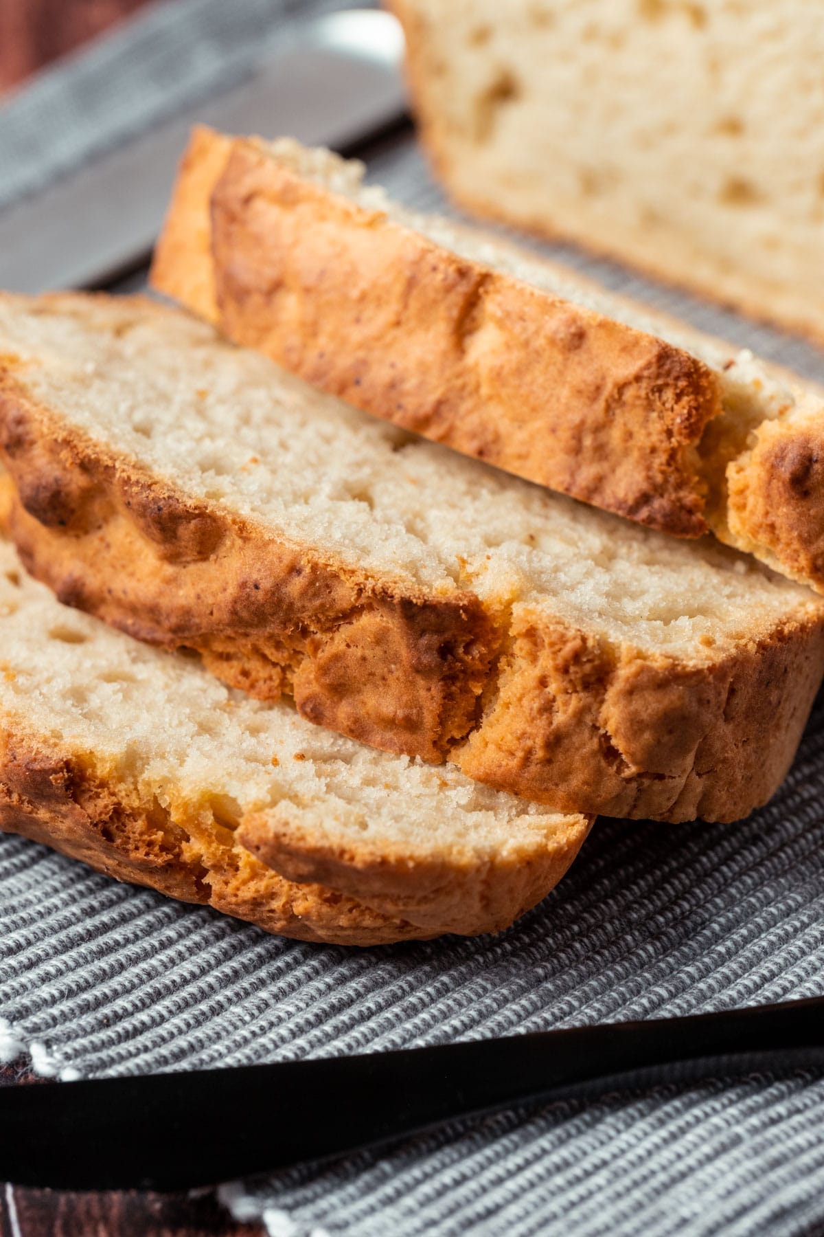 Sliced vegan beer bread on a napkin.