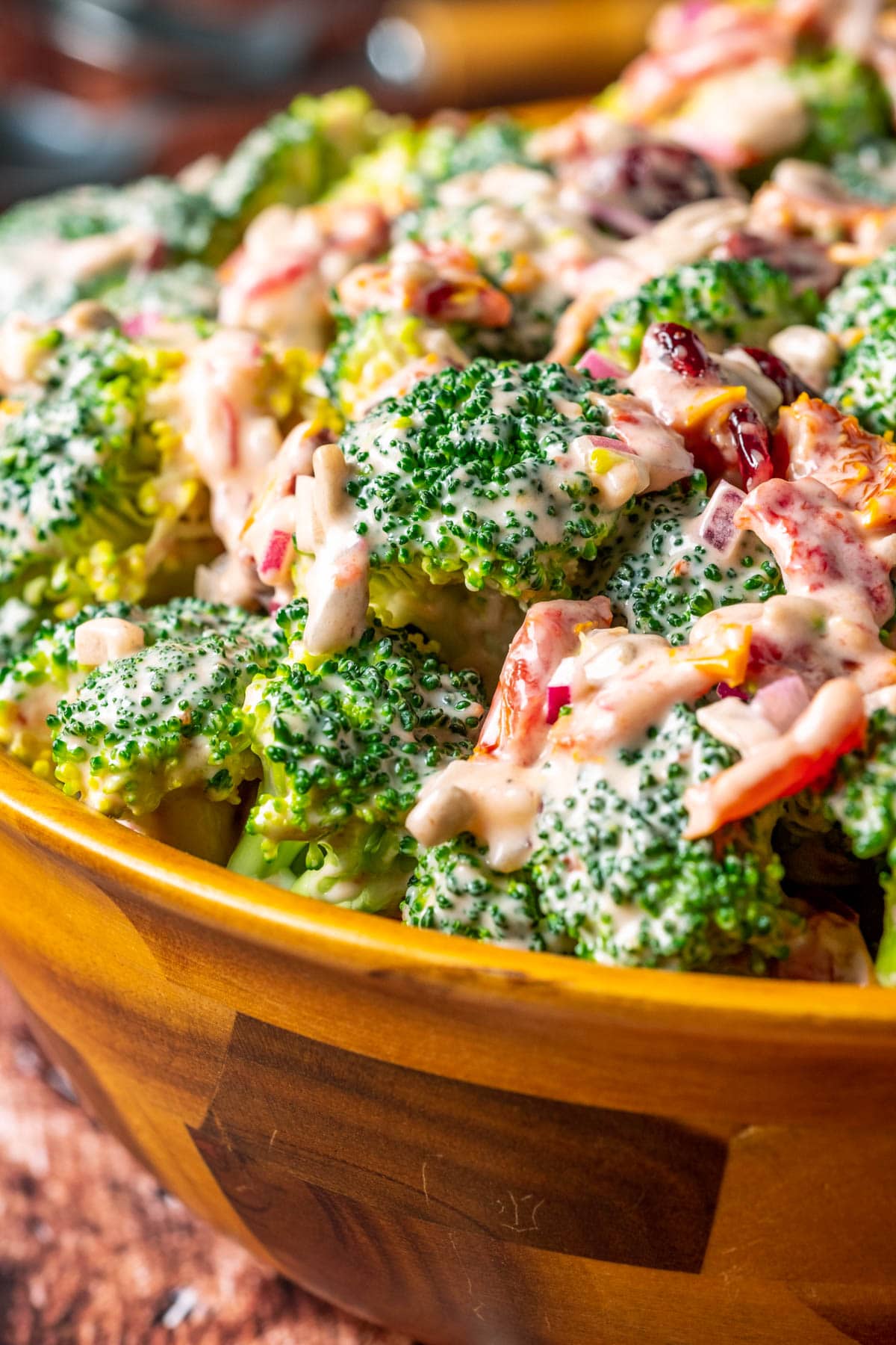 Vegan broccoli salad in a wooden salad bowl.