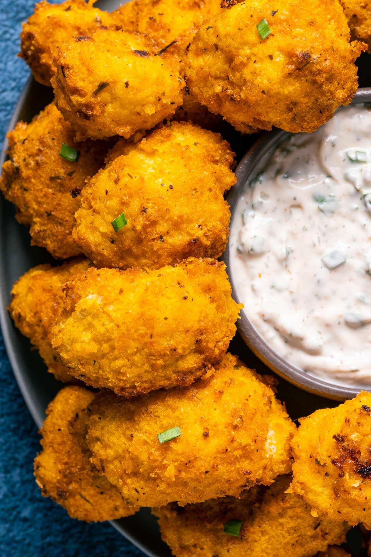 Buffalo cauliflower on a plate with ranch dressing.