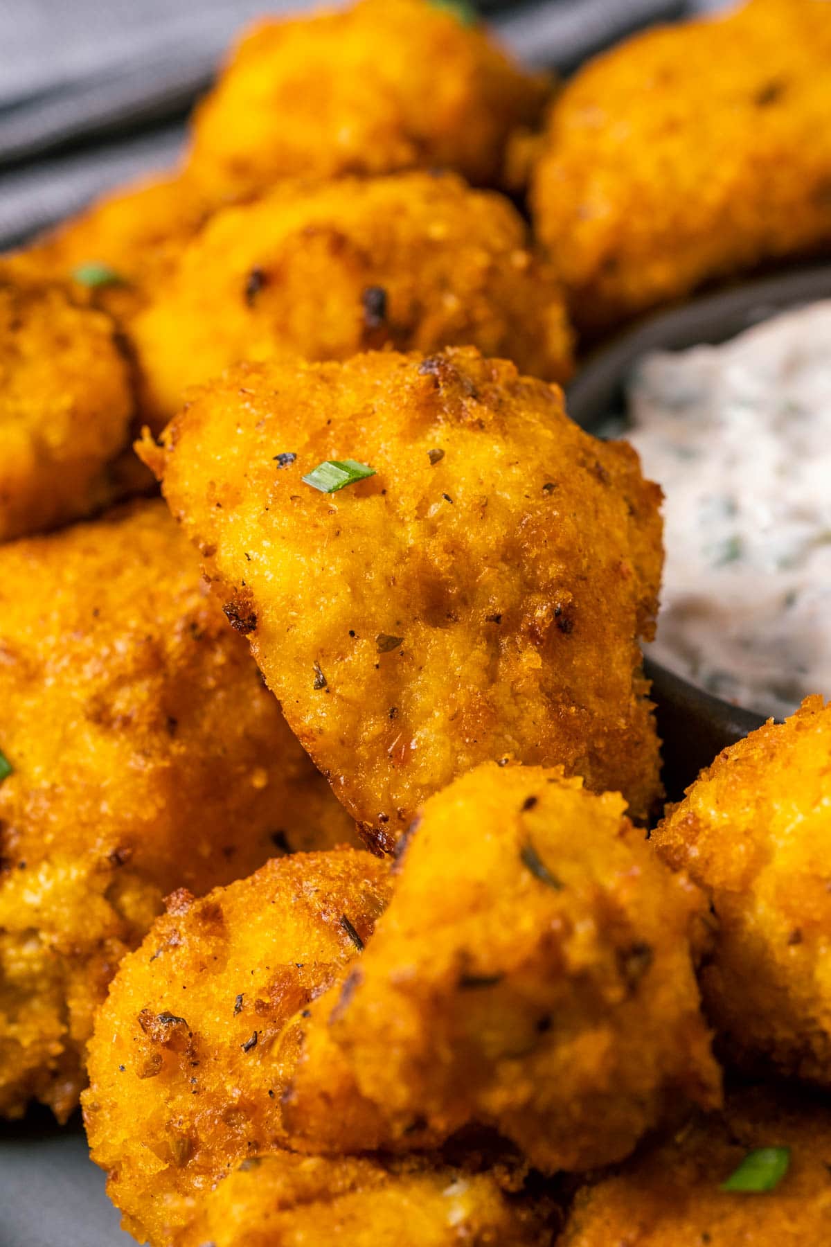 Buffalo cauliflower on a plate with ranch dressing.