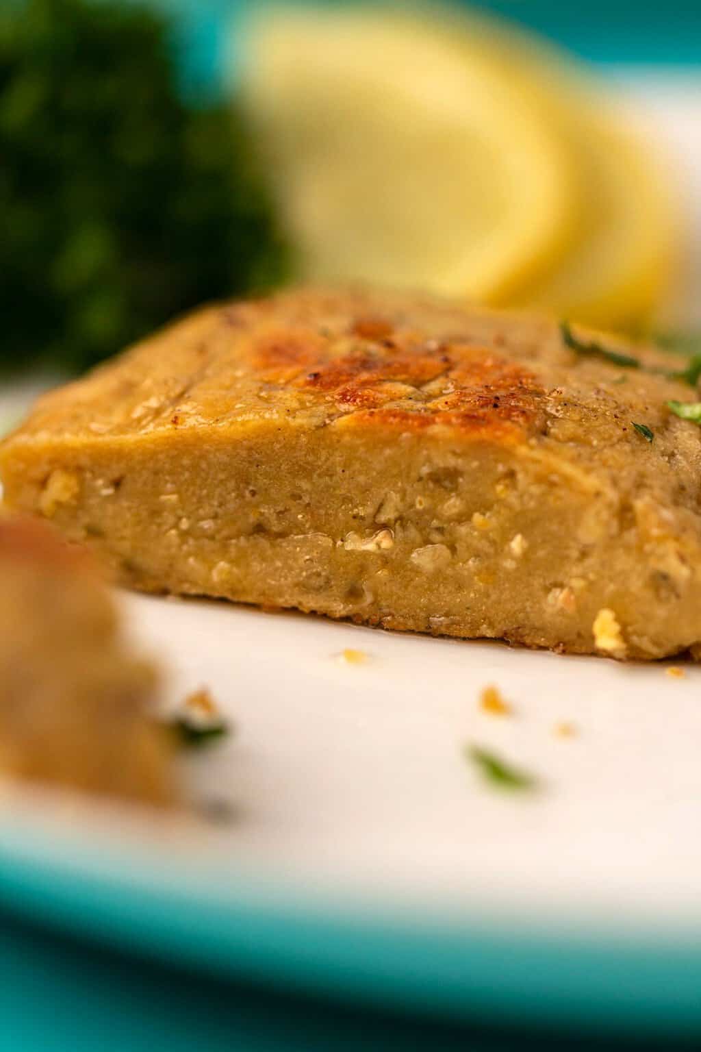 Vegan chicken fillet on a white plate. 