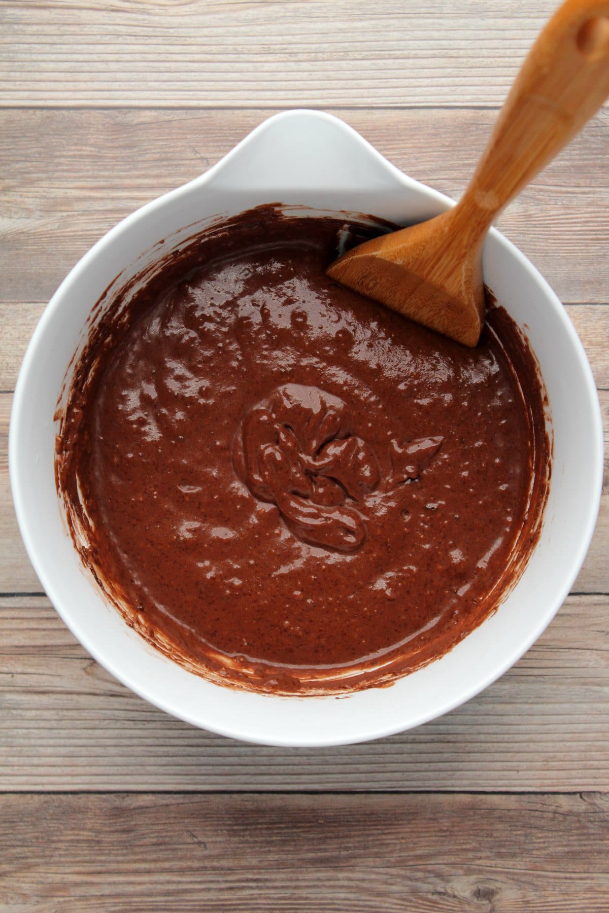 Batter for chocolate muffins in a mixing bowl. 