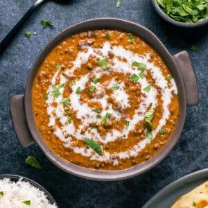 Vegan dal makhani in a brown bowl.