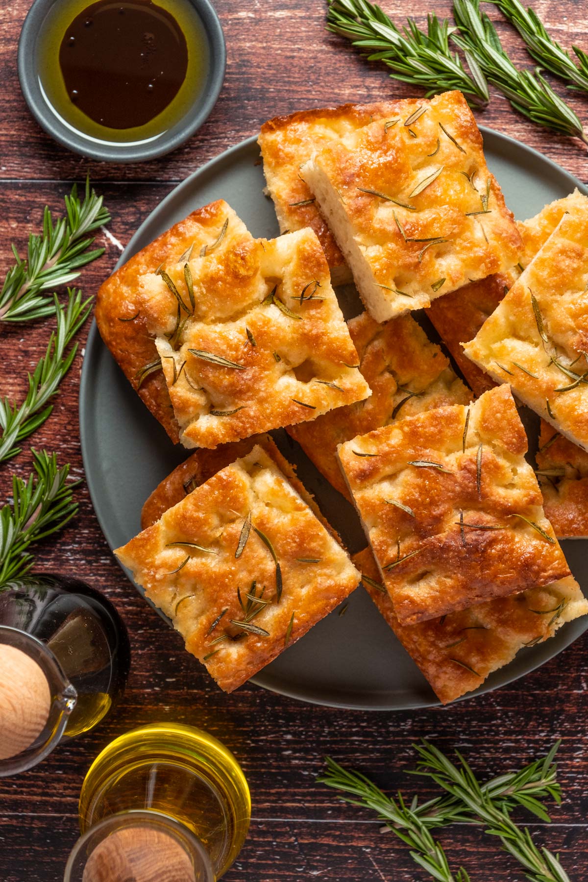 Vegan focaccia stacked up on a plate. 