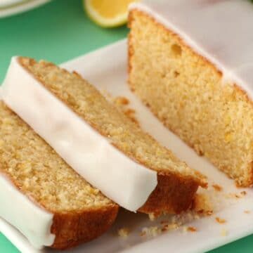 Sliced vegan lemon pound cake on a white plate.