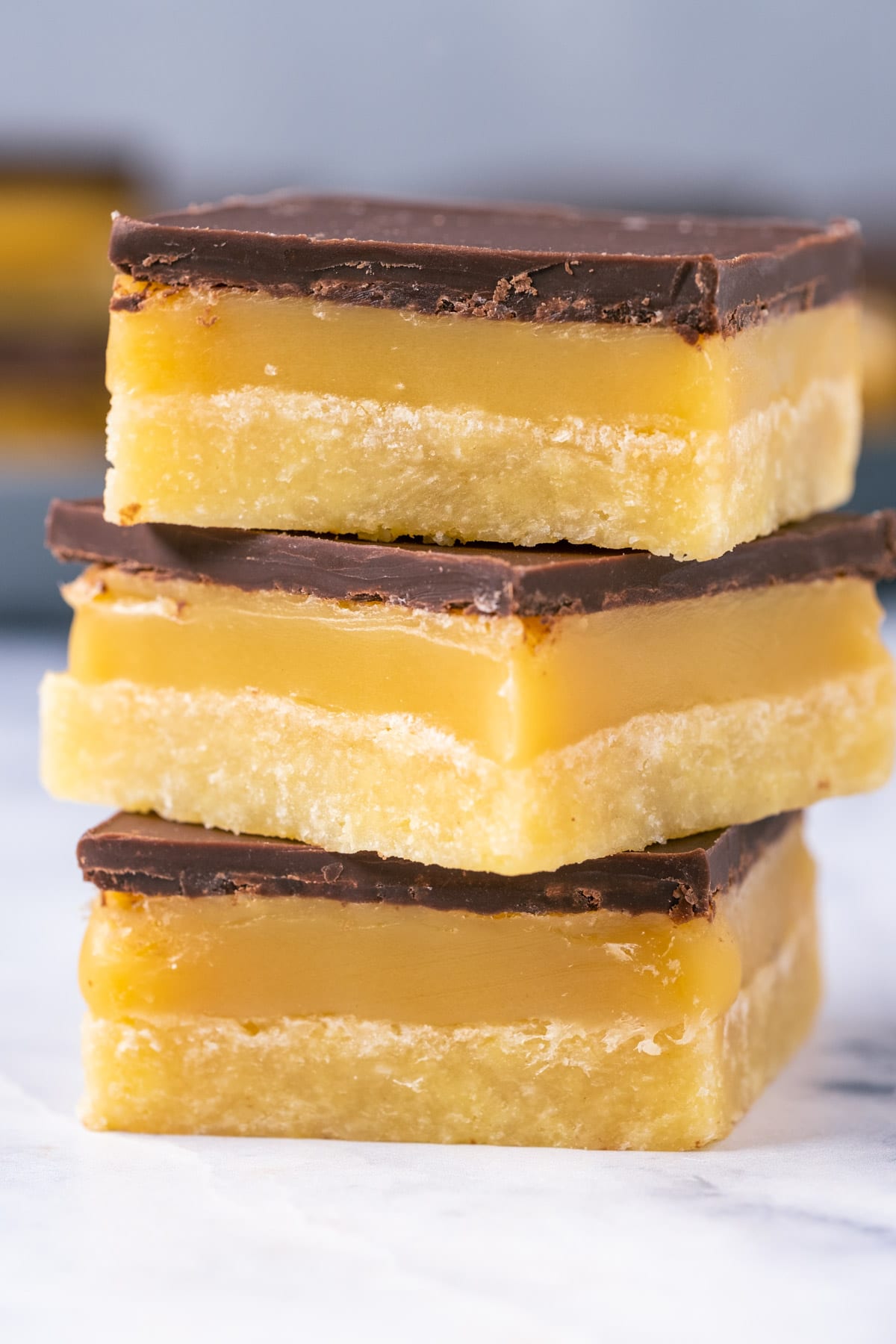 Stack of three vegan millionaire shortbread. 