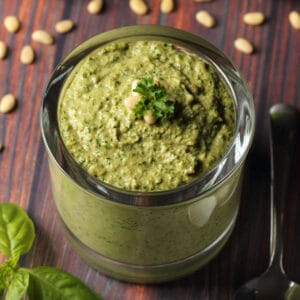 Vegan pesto in a glass jar.