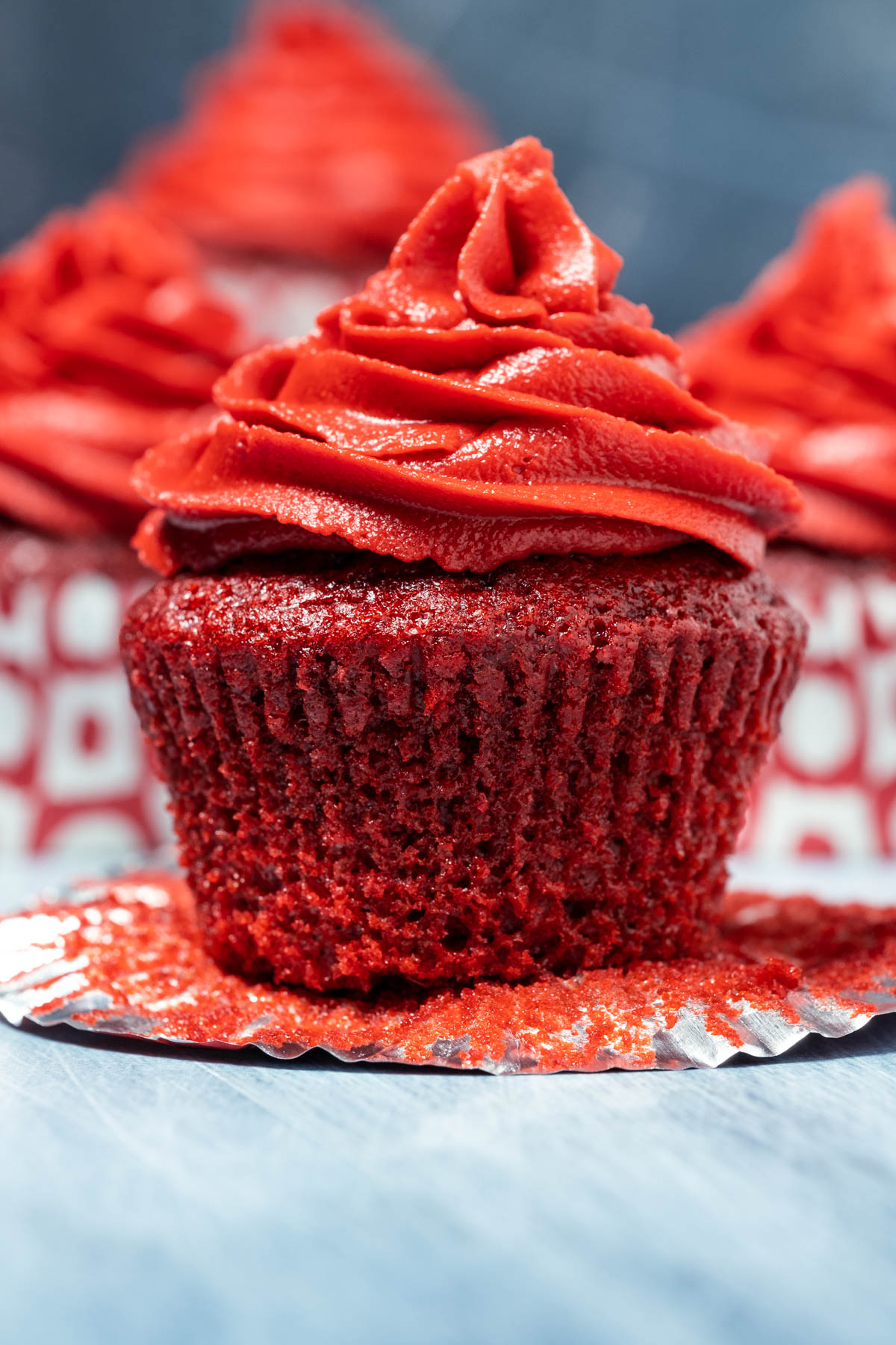 Vegan red velvet cupcake with the liner pulled down.