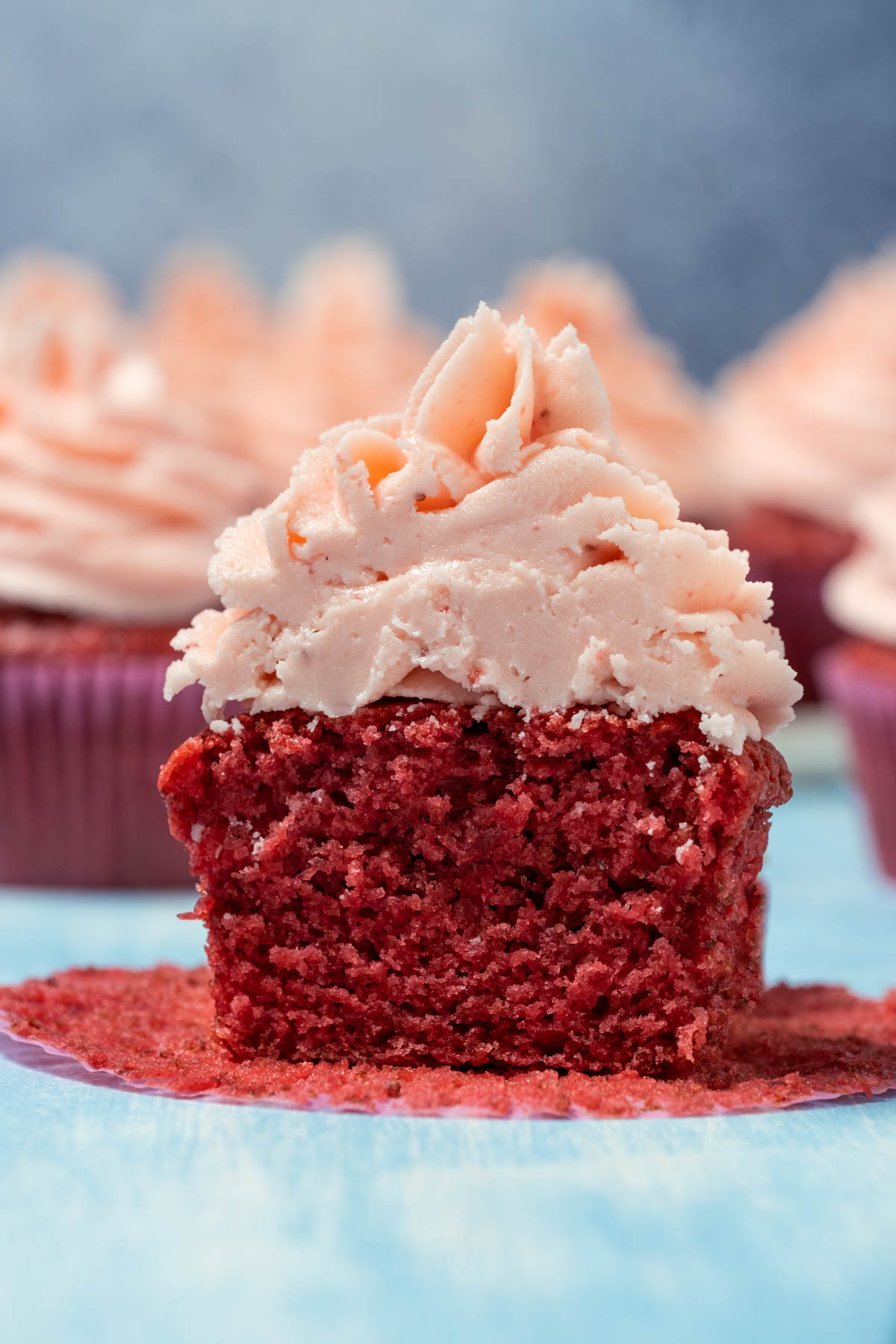 Vegan strawberry cupcake cut in half.