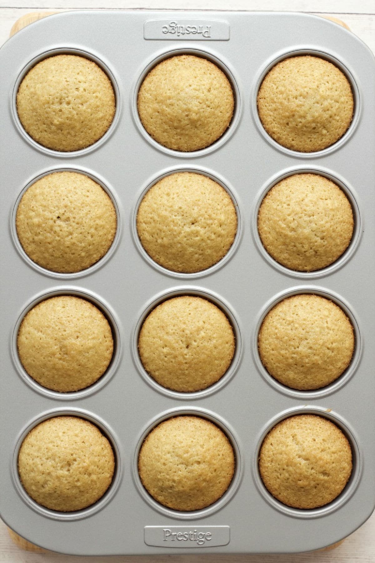 Freshly baked cupcakes in a cupcake tray.