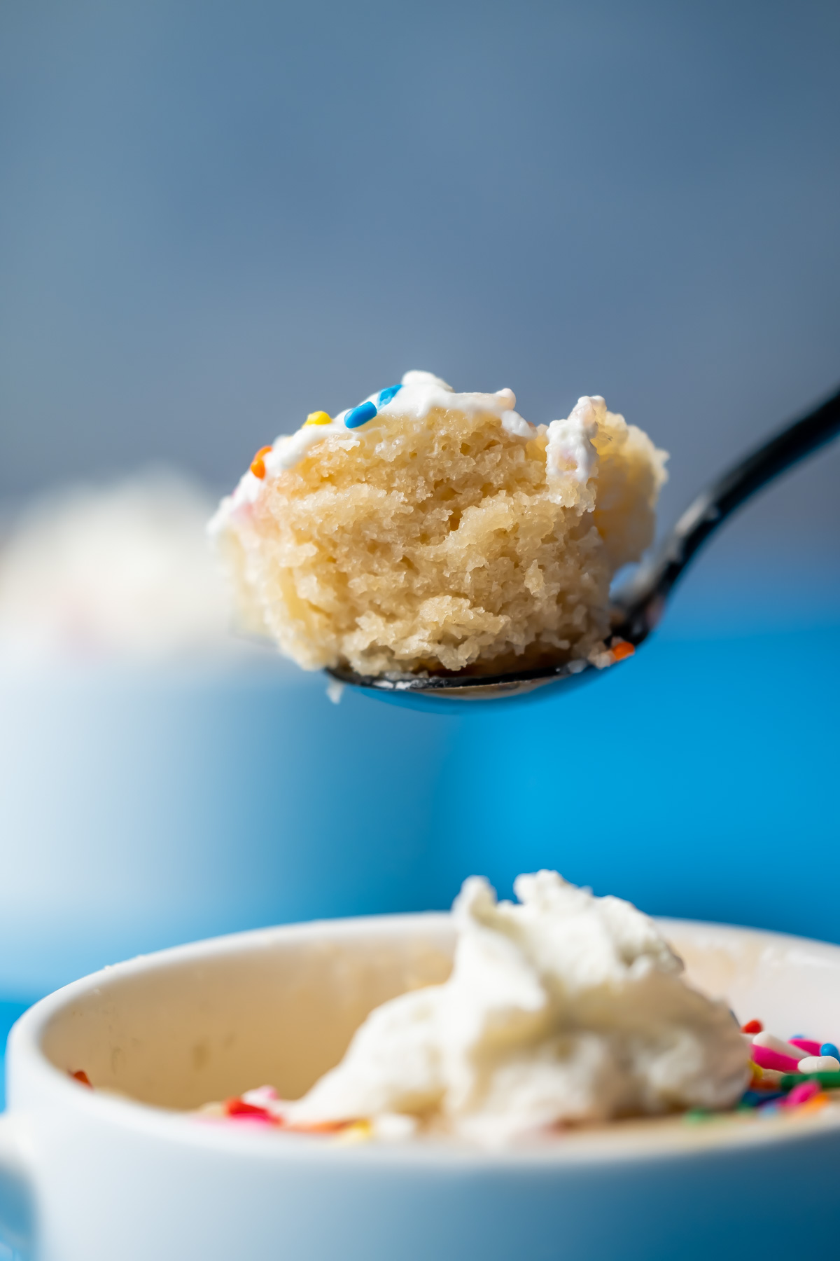 Spoonful of vegan vanilla mug cake.