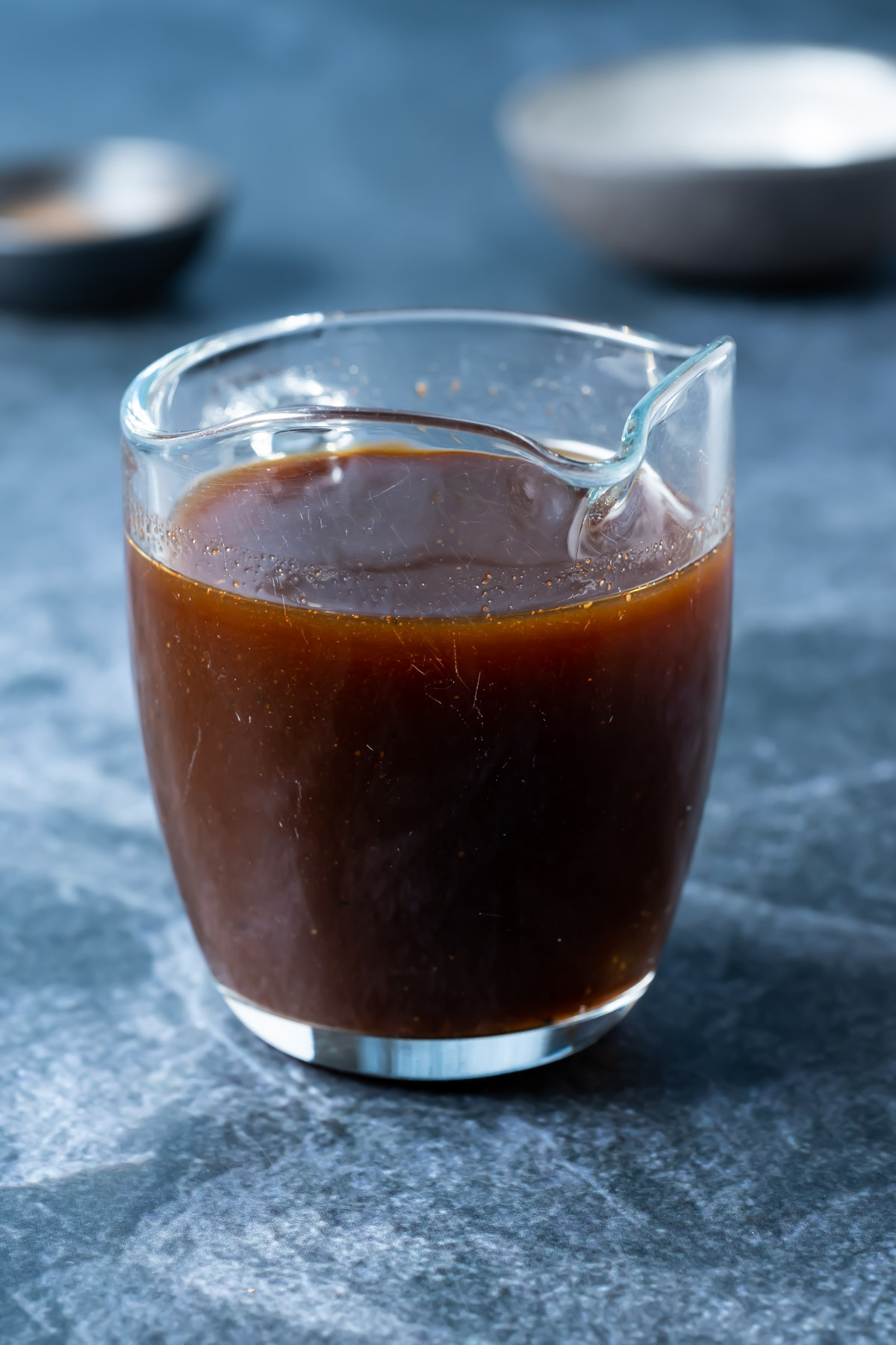 Vegan worcestershire sauce in a glass jug. 